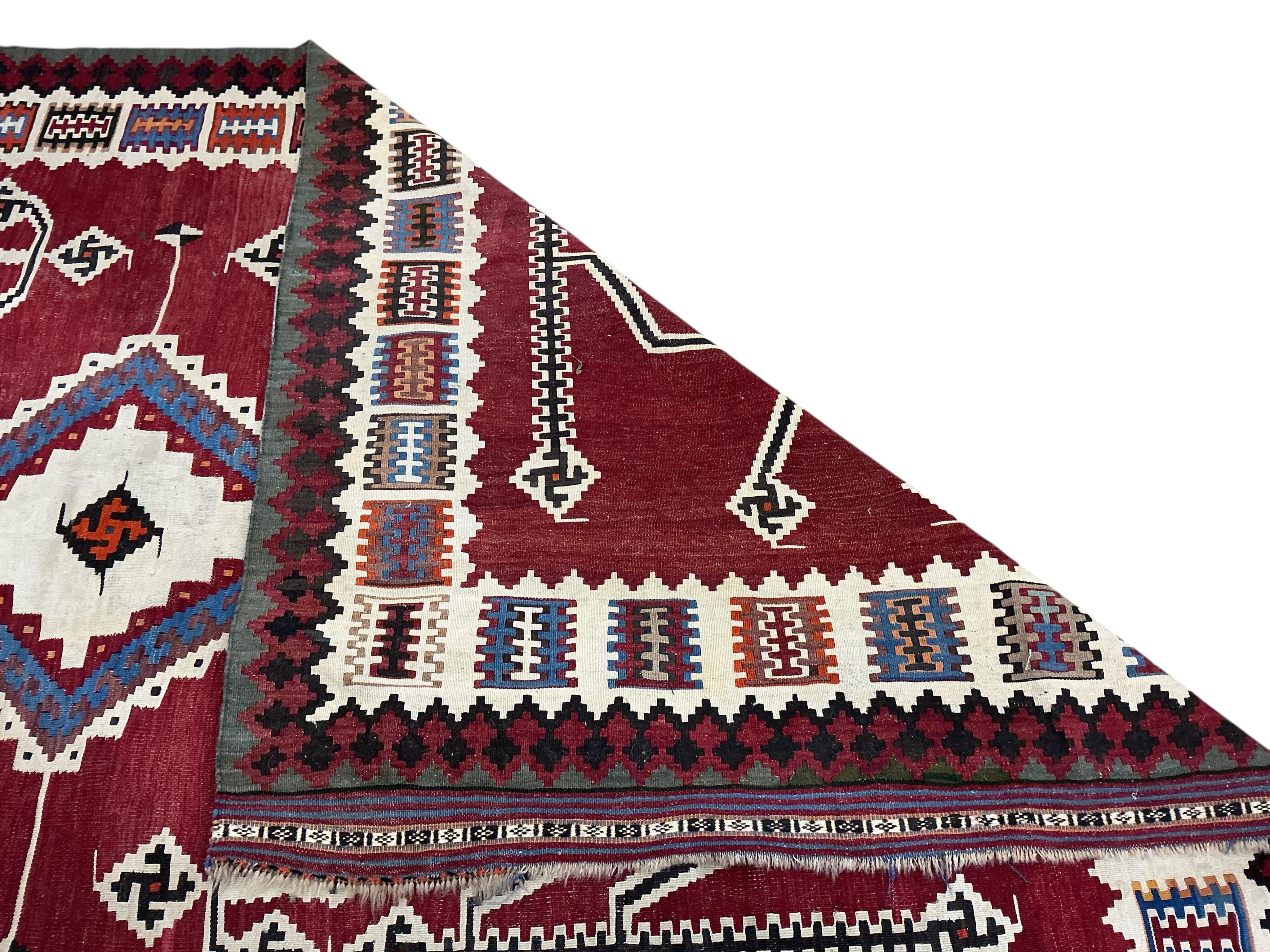 A Persian polychrome Kilim carpet, 284 x 160cm